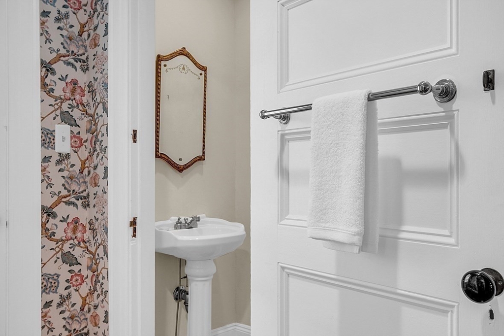 24 Sandy Pond Road Lincoln, MA 01773 - Photo 21 of 42 a bathroom with a sink and mirror