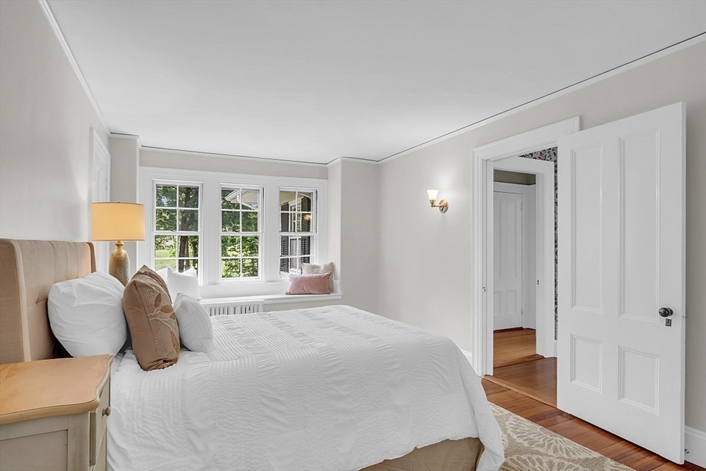 24 Sandy Pond Road Lincoln, MA 01773 - Photo 24 of 42 a bedroom with a bed and a window