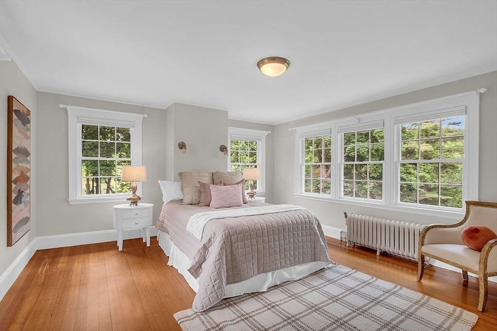 24 Sandy Pond Road Lincoln, MA 01773 - Photo 26 of 42 a bedroom with a bed and a window