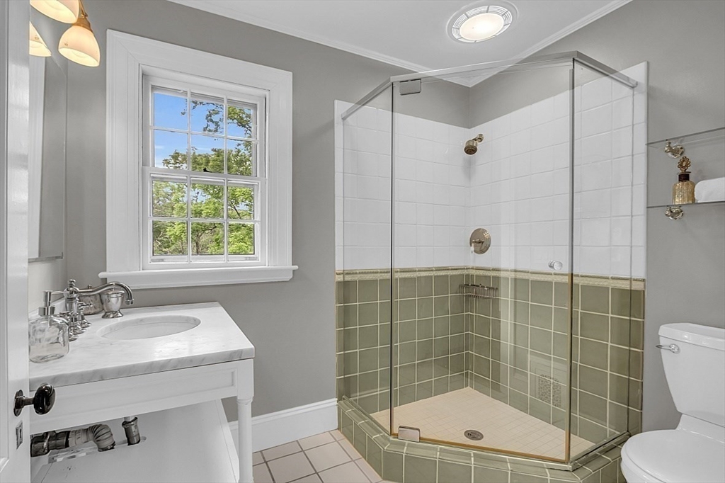 24 Sandy Pond Road Lincoln, MA 01773 - Photo 27 of 42 a bathroom with a sink toilet and shower