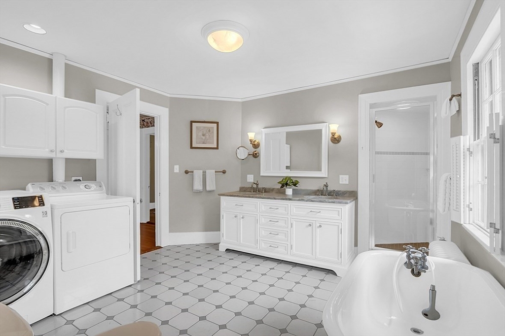 24 Sandy Pond Road Lincoln, MA 01773 - Photo 32 of 42 a kitchen with a sink a washer and dryer