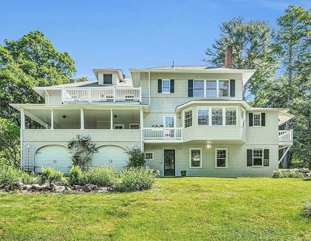 24 Sandy Pond Road Lincoln, MA 01773 - Photo 33 of 42 a front view of a house with a yard