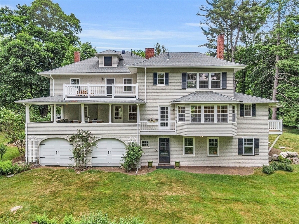 24 Sandy Pond Road Lincoln, MA 01773 - Photo 40 of 42 a front view of a house with a garden