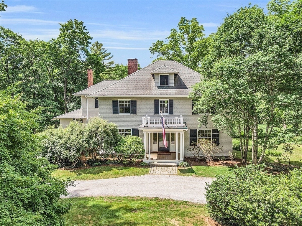 24 Sandy Pond Road Lincoln, MA 01773 - Photo 42 of 42 a front view of a house with a yard