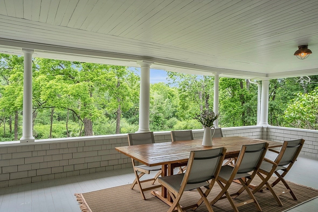 24 Sandy Pond Road Lincoln, MA 01773 - Photo 8 of 42 a view of a dining room with furniture and window