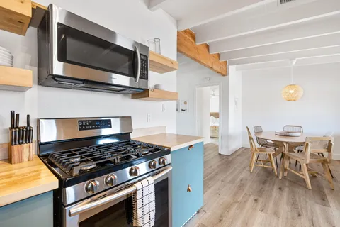 a kitchen with a stove and a microwave