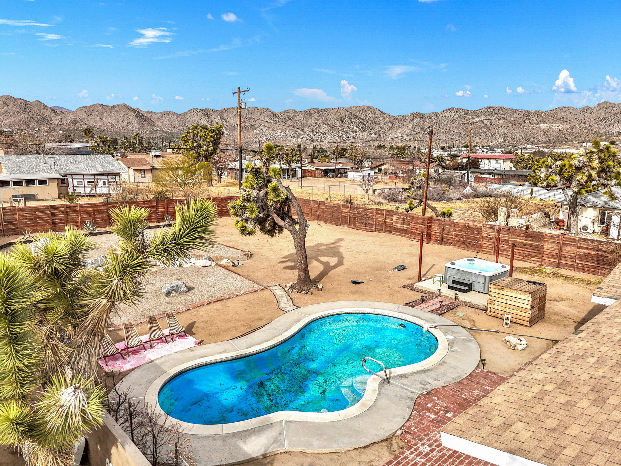 7552 Elk Trail Yucca Valley, CA 92284 - Photo 2 of 48 a view of a swimming pool with mountain view