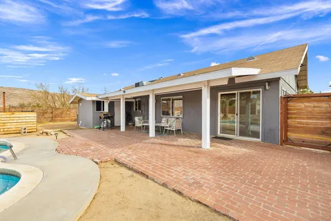 a front view of a house with a patio