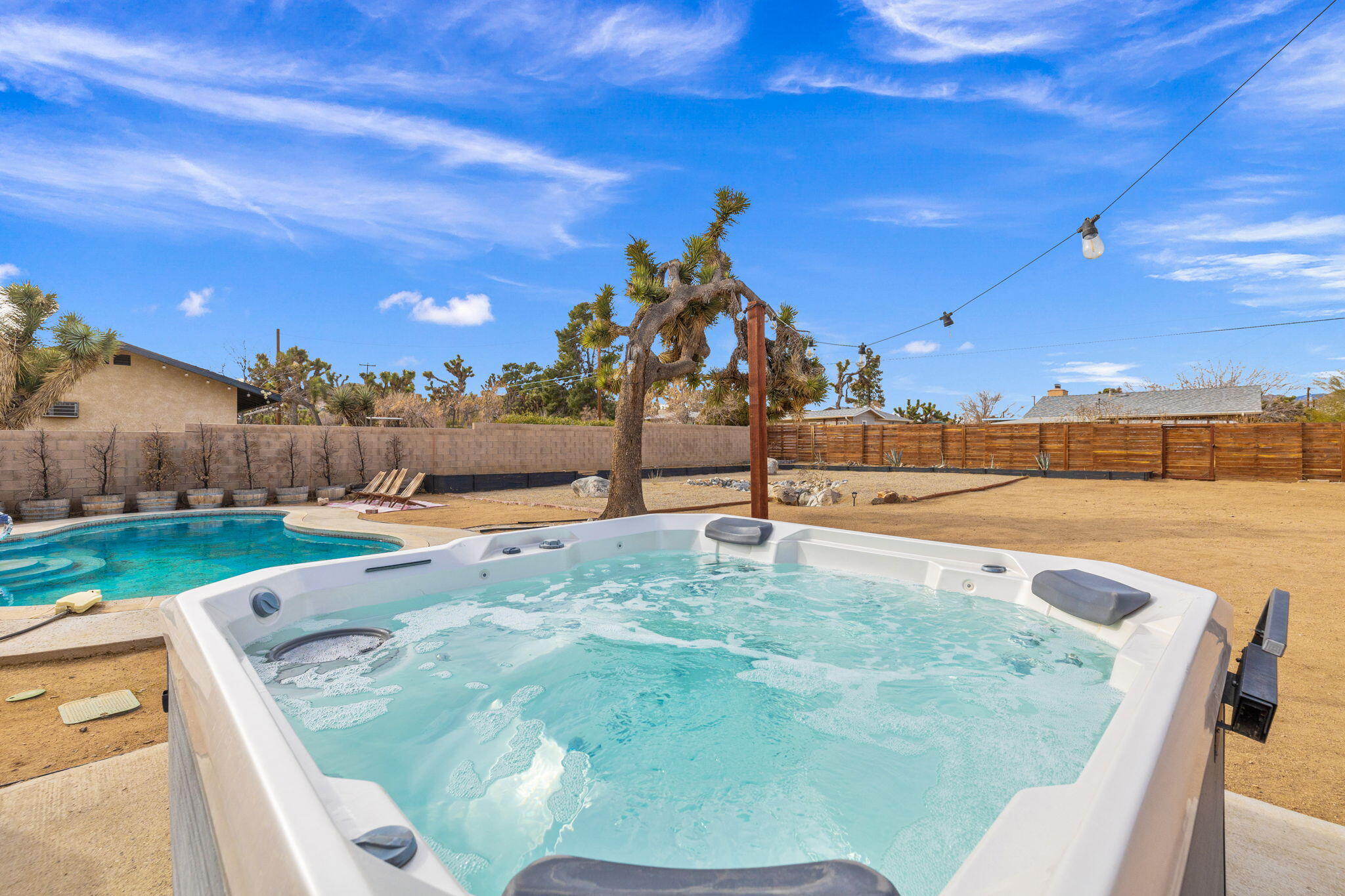 7552 Elk Trail Yucca Valley, CA 92284 - Photo 34 of 48 a view of a swimming pool with a yard