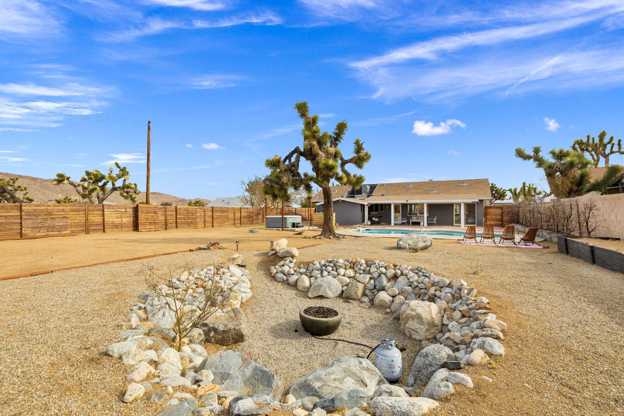7552 Elk Trail Yucca Valley, CA 92284 - Photo 41 of 48 a front view of a house with a yard
