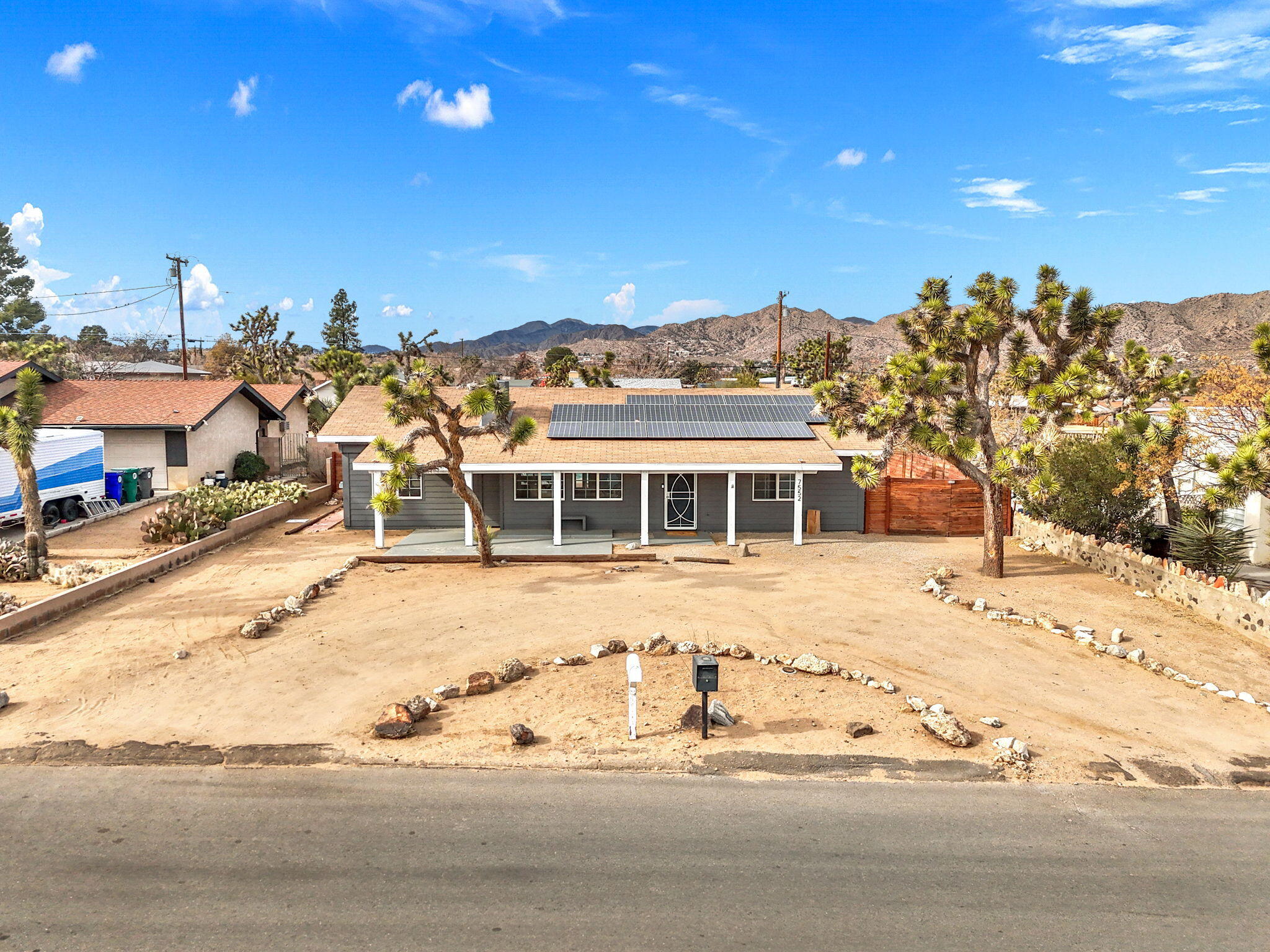 7552 Elk Trail Yucca Valley, CA 92284 - Photo 42 of 48 a view of a house with a yard