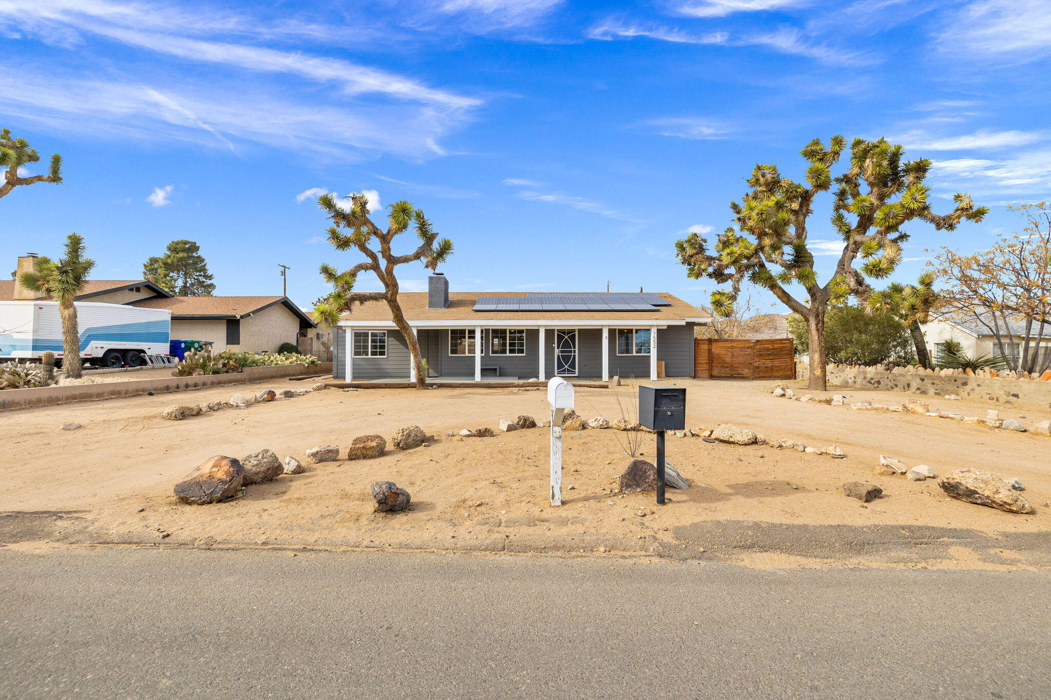 7552 Elk Trail Yucca Valley, CA 92284 - Photo 46 of 48 a front view of a house with a yard