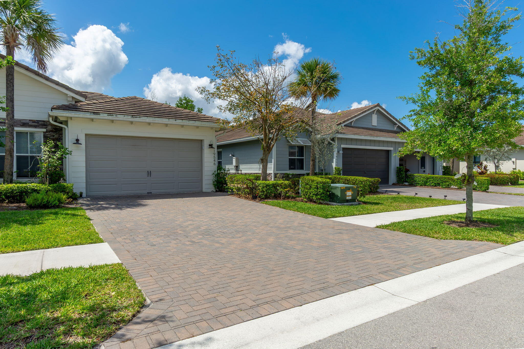 19546 Weathervane Way Loxahatchee, FL 33470 - Photo 1 of 63 a front view of a house with a yard and garage