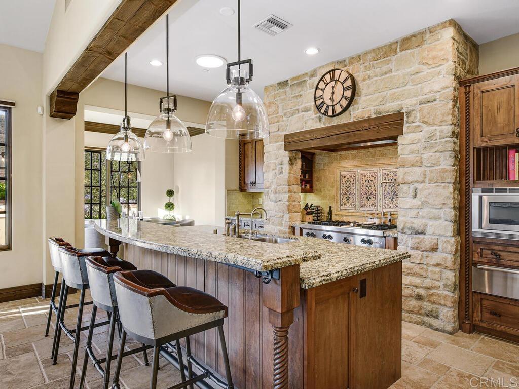 4272 Via Ravello Rancho Santa Fe, CA 92091 - Photo 12 of 38 a kitchen with a table and chairs in it