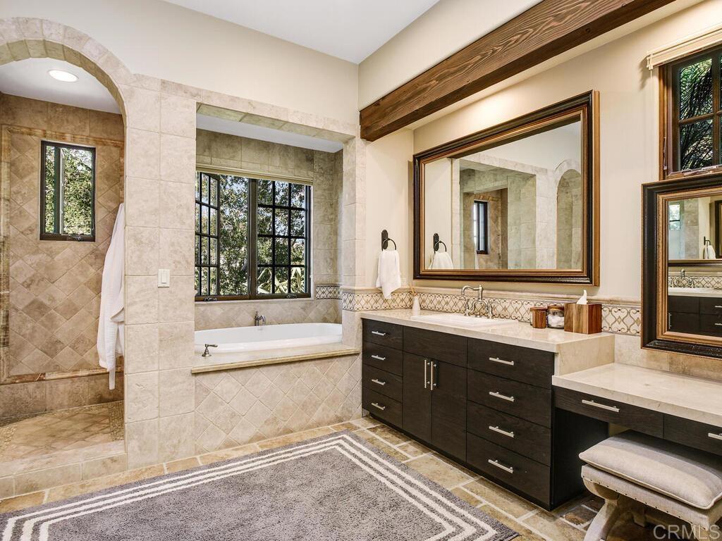4272 Via Ravello Rancho Santa Fe, CA 92091 - Photo 18 of 38 a bathroom with a tub sink and mirror