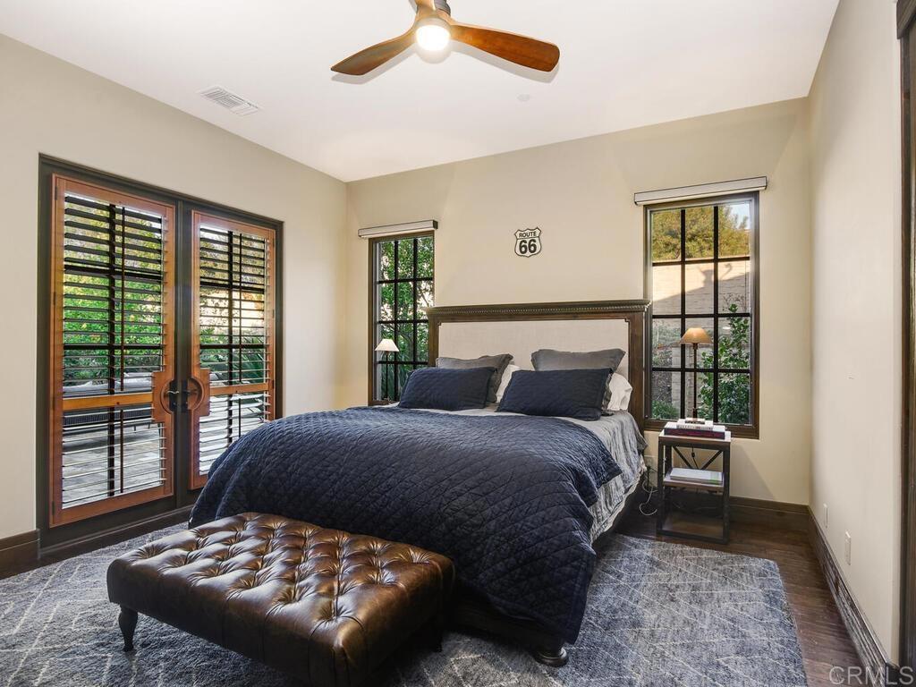 4272 Via Ravello Rancho Santa Fe, CA 92091 - Photo 20 of 38 a bedroom with a large bed and a large window