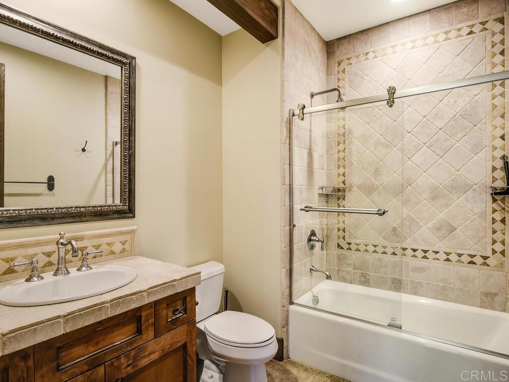 4272 Via Ravello Rancho Santa Fe, CA 92091 - Photo 21 of 38 a bathroom with a sink and a mirror