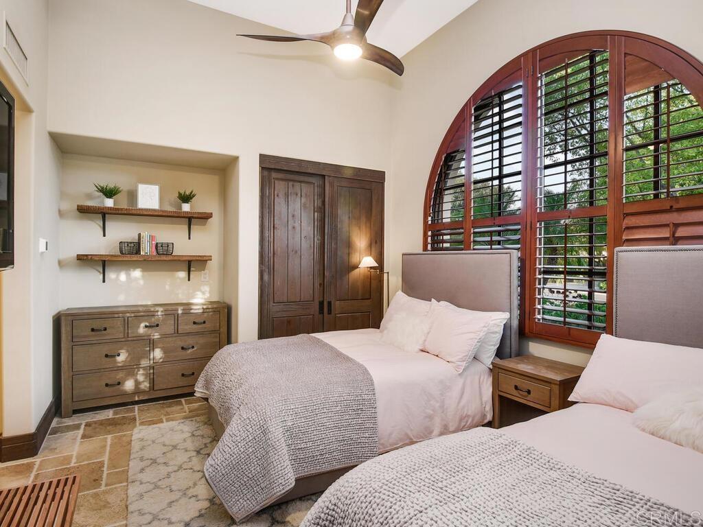 4272 Via Ravello Rancho Santa Fe, CA 92091 - Photo 22 of 38 a bedroom with furniture and a window