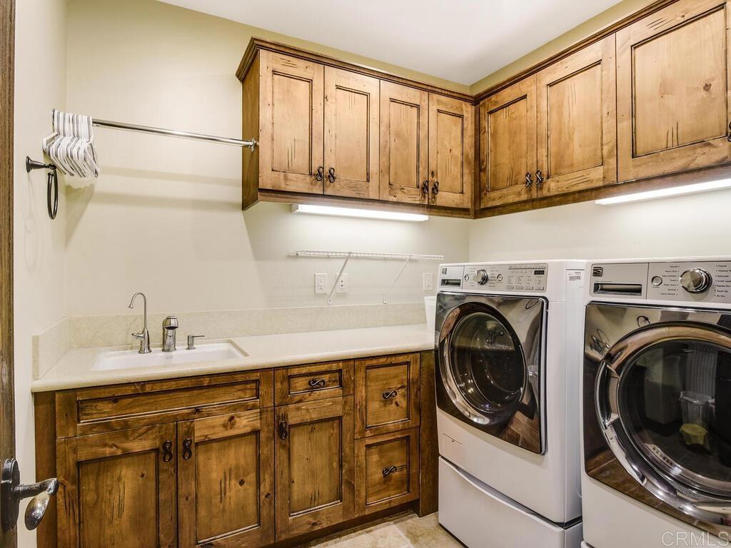 4272 Via Ravello Rancho Santa Fe, CA 92091 - Photo 26 of 38 a utility room with dryer and washer