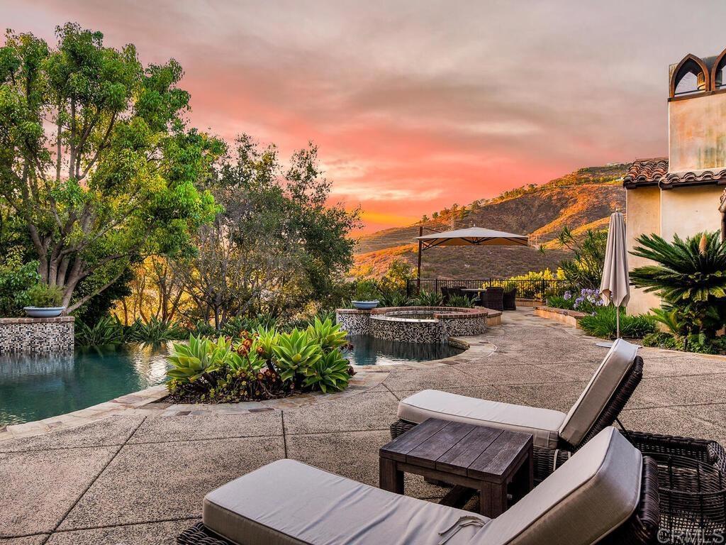 4272 Via Ravello Rancho Santa Fe, CA 92091 - Photo 36 of 38 a view of a patio with couches table and chairs and potted plants