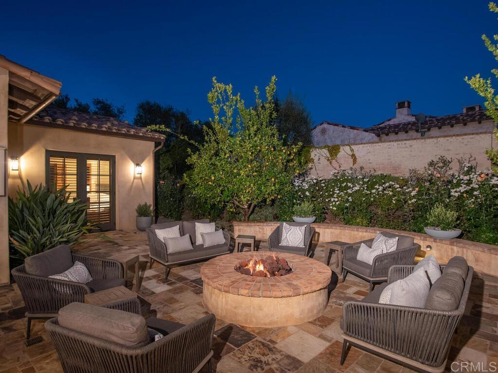 4272 Via Ravello Rancho Santa Fe, CA 92091 - Photo 38 of 38 a view of a patio with couches table and chairs and potted plants