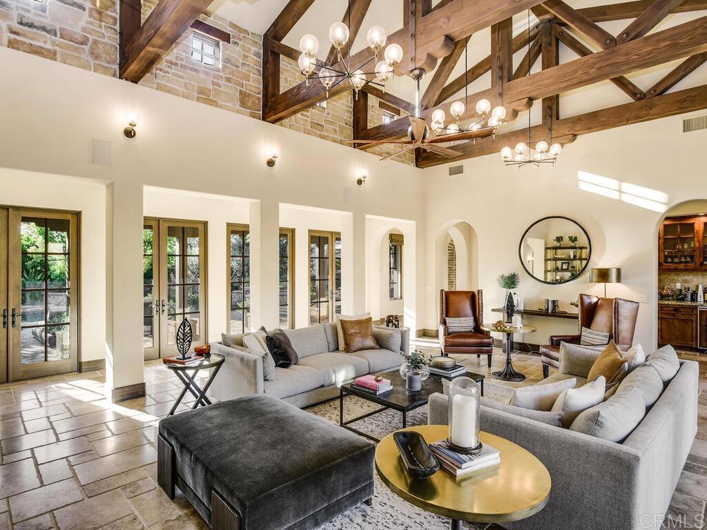 4272 Via Ravello Rancho Santa Fe, CA 92091 - Photo 9 of 38 a living room with fireplace furniture and a large window