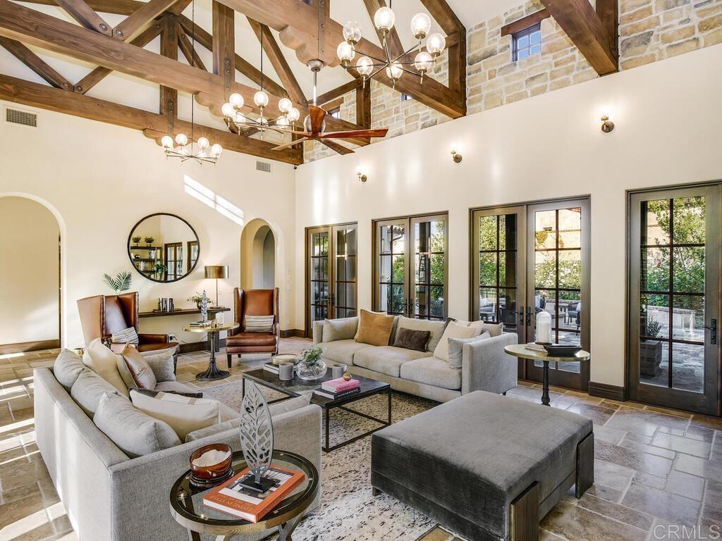 4272 Via Ravello Rancho Santa Fe, CA 92091 - Photo 10 of 38 a living room with furniture a rug and a chandelier