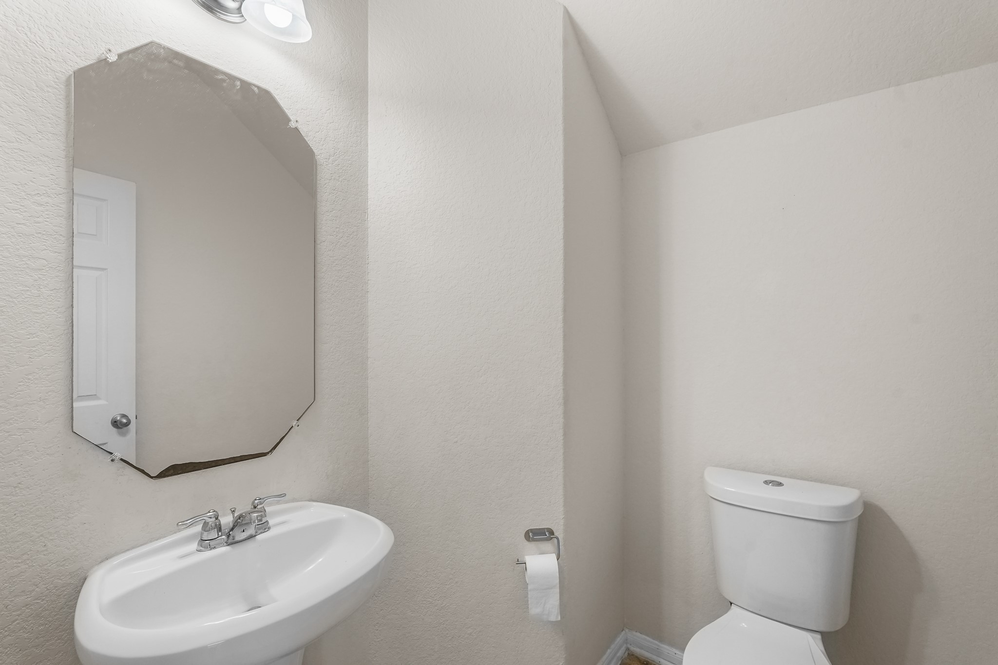 3215 Upland Spring Trace Katy, TX 77493 - Photo 11 of 24 a bathroom with a toilet sink and mirror