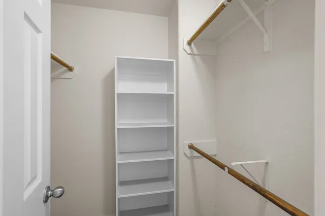 a view of a kitchen with a dishwasher cabinets and wooden floor