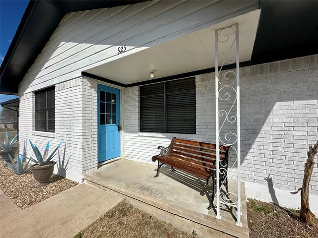 a front view of a house with stairs