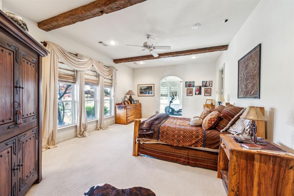 868 English Road Rockwall, TX 75032 - Photo 13 of 37 a bedroom with furniture and a window