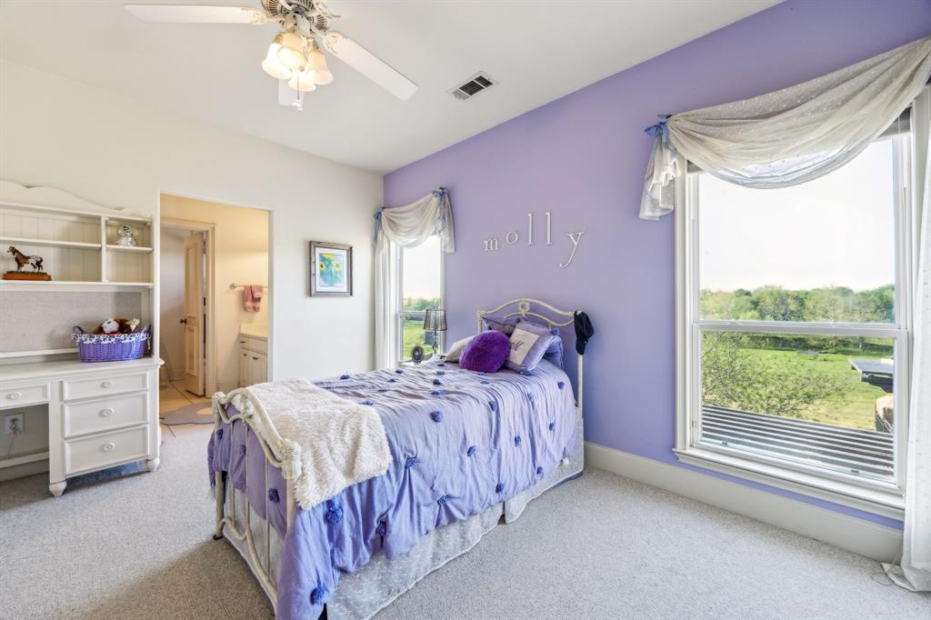 868 English Road Rockwall, TX 75032 - Photo 19 of 37 a bedroom with a bed and a window