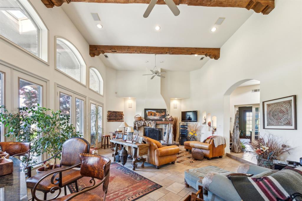 868 English Road Rockwall, TX 75032 - Photo 6 of 37 a living room with furniture and a chandelier