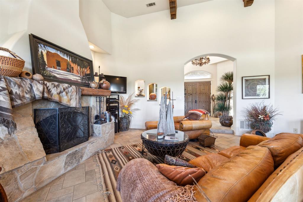 868 English Road Rockwall, TX 75032 - Photo 7 of 37 a living room with furniture and a fireplace