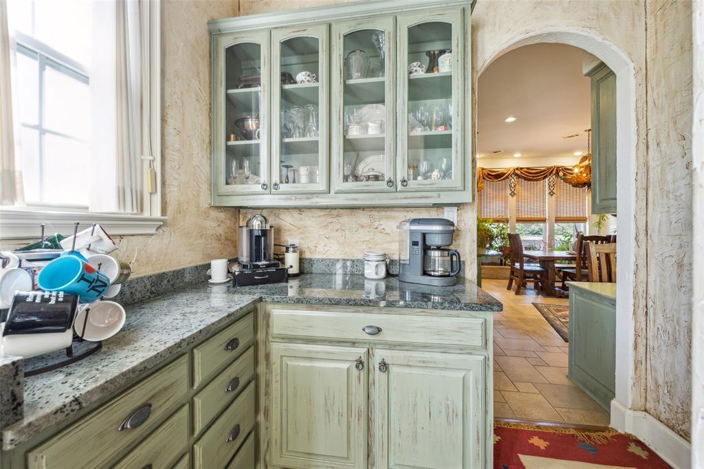 868 English Road Rockwall, TX 75032 - Photo 10 of 37 a kitchen with stainless steel appliances granite countertop a sink stove and cabinets