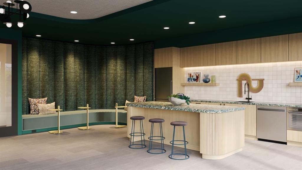 596 West 9th Street, Unit 339 Dallas, TX 75208 - Photo 11 of 22 Kitchen featuring a kitchen breakfast bar, light stone counters, a kitchen island, appliances with stainless steel finishes, and light wood-style floors