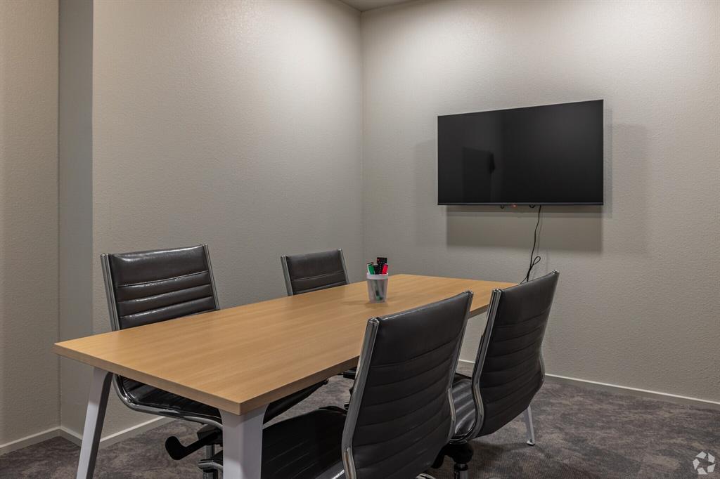 596 West 9th Street, Unit 339 Dallas, TX 75208 - Photo 3 of 22 Office area with a textured wall and dark colored carpet