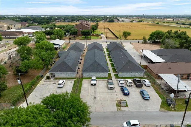 an aerial view of a house with a lake view