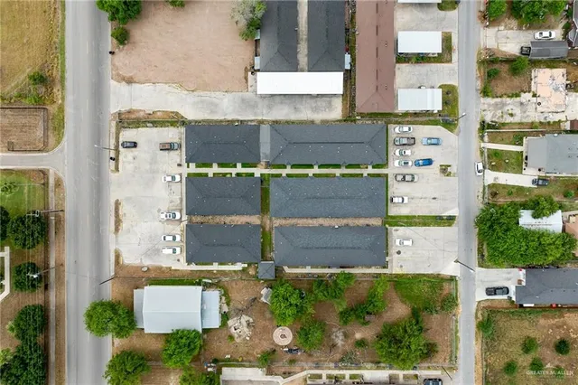 an aerial view of residential houses with outdoor space