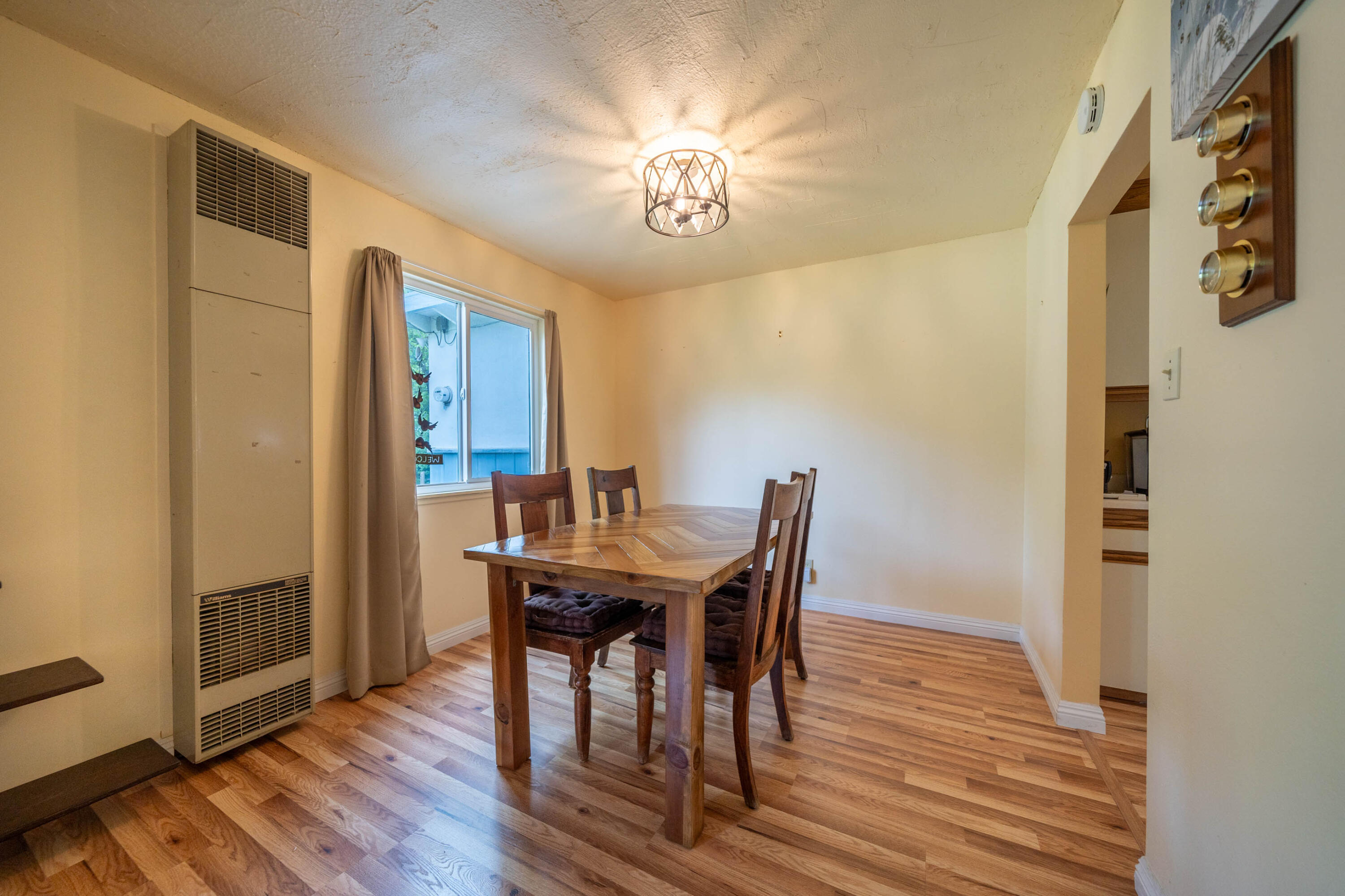 3055 Sharon Avenue Anderson, CA 96007 - Photo 12 of 52 a view of a dining room with furniture and wooden floor