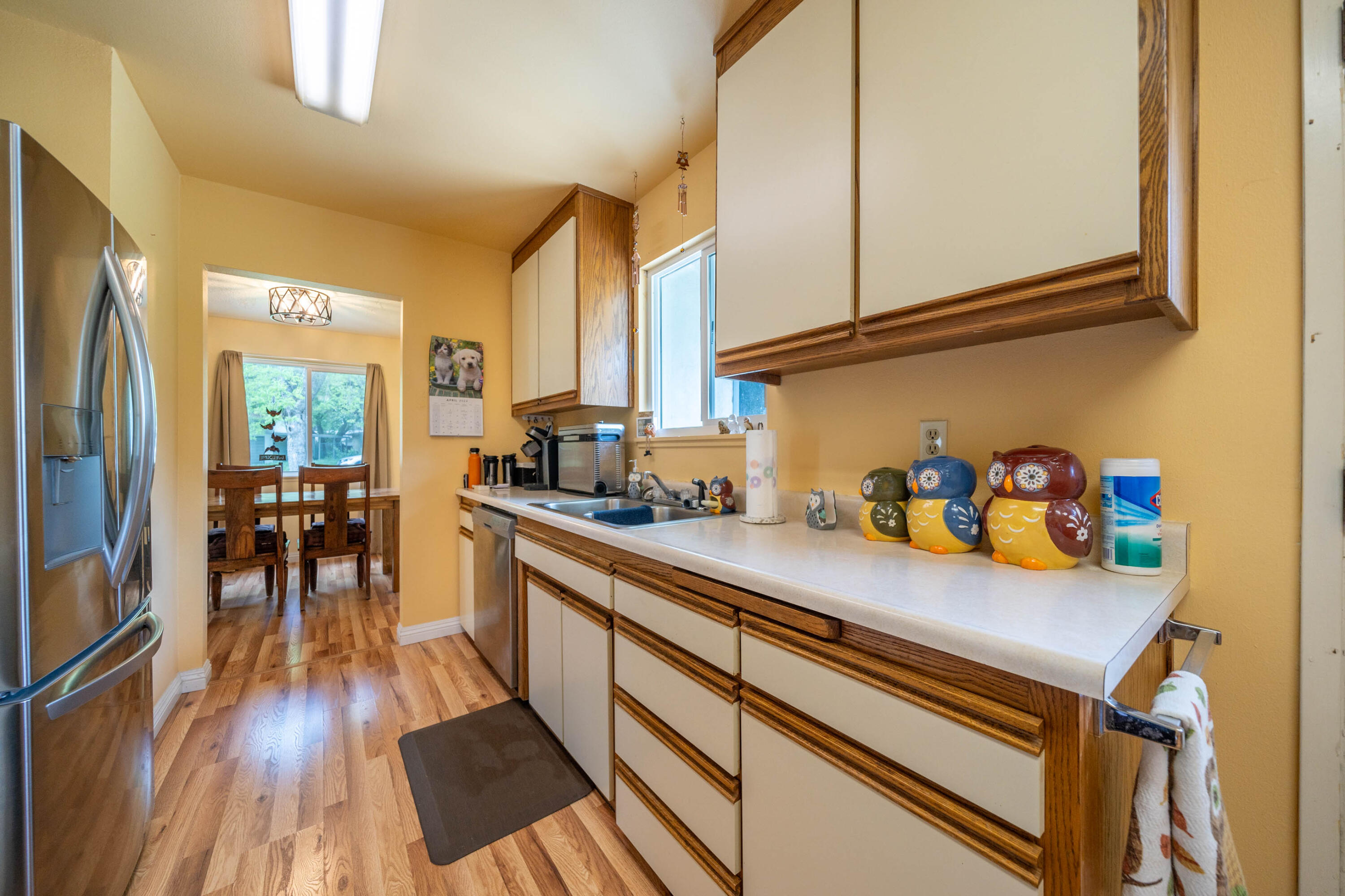 3055 Sharon Avenue Anderson, CA 96007 - Photo 14 of 52 a kitchen with granite countertop lots of counter top space and wooden floor