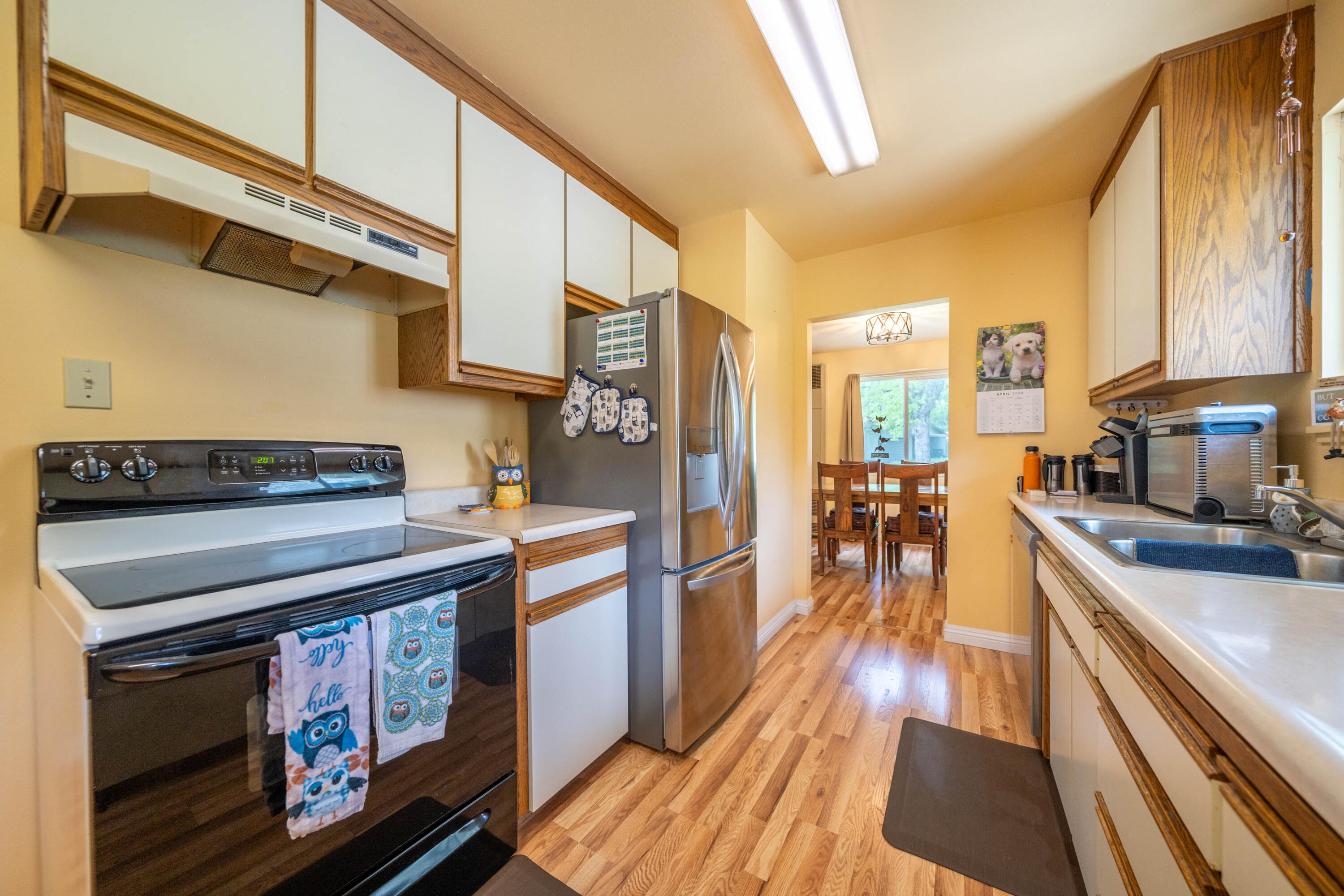 3055 Sharon Avenue Anderson, CA 96007 - Photo 15 of 52 a kitchen with stainless steel appliances granite countertop a stove a sink and a refrigerator