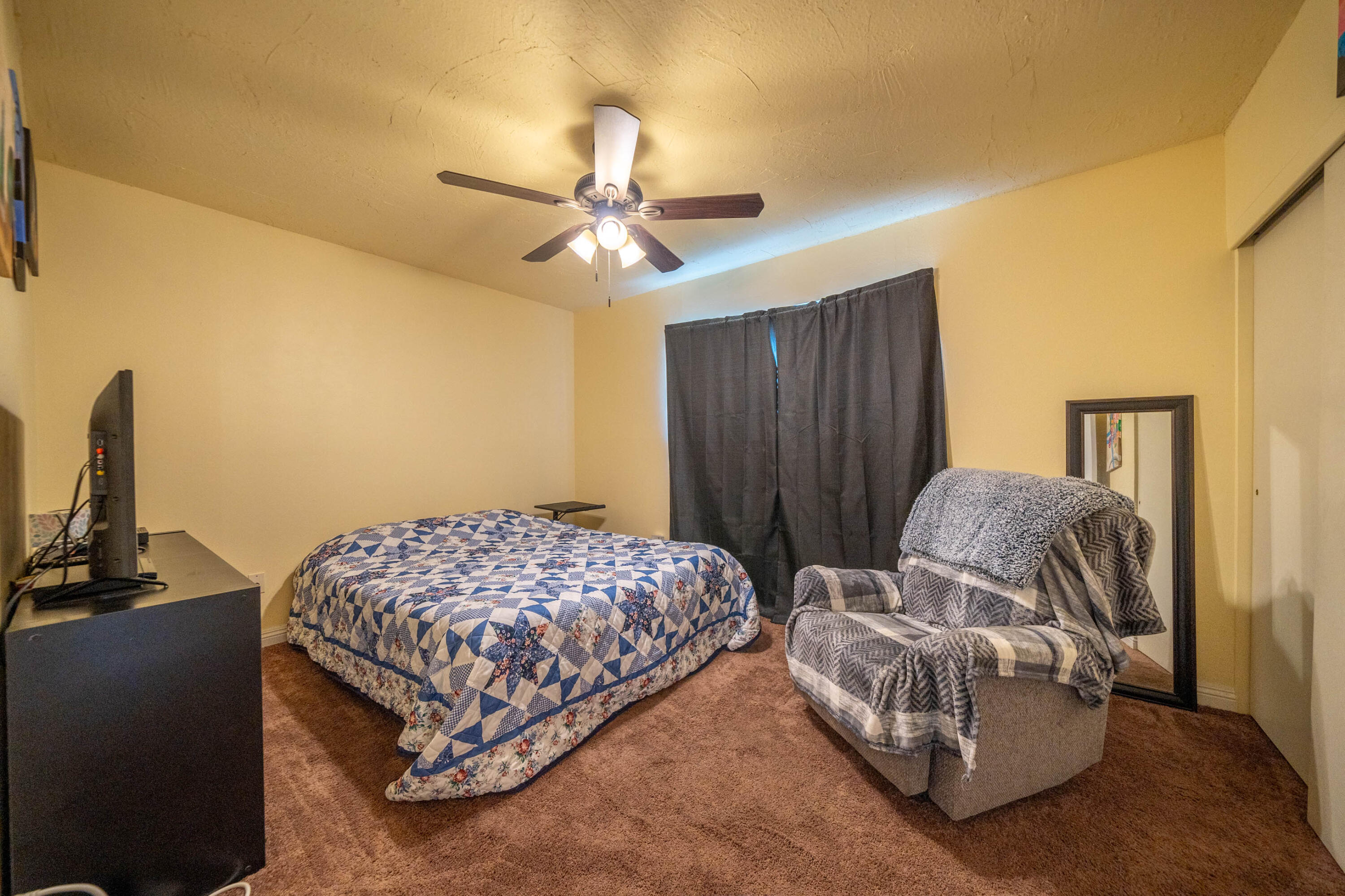 3055 Sharon Avenue Anderson, CA 96007 - Photo 18 of 52 a bedroom with two beds and a chandelier