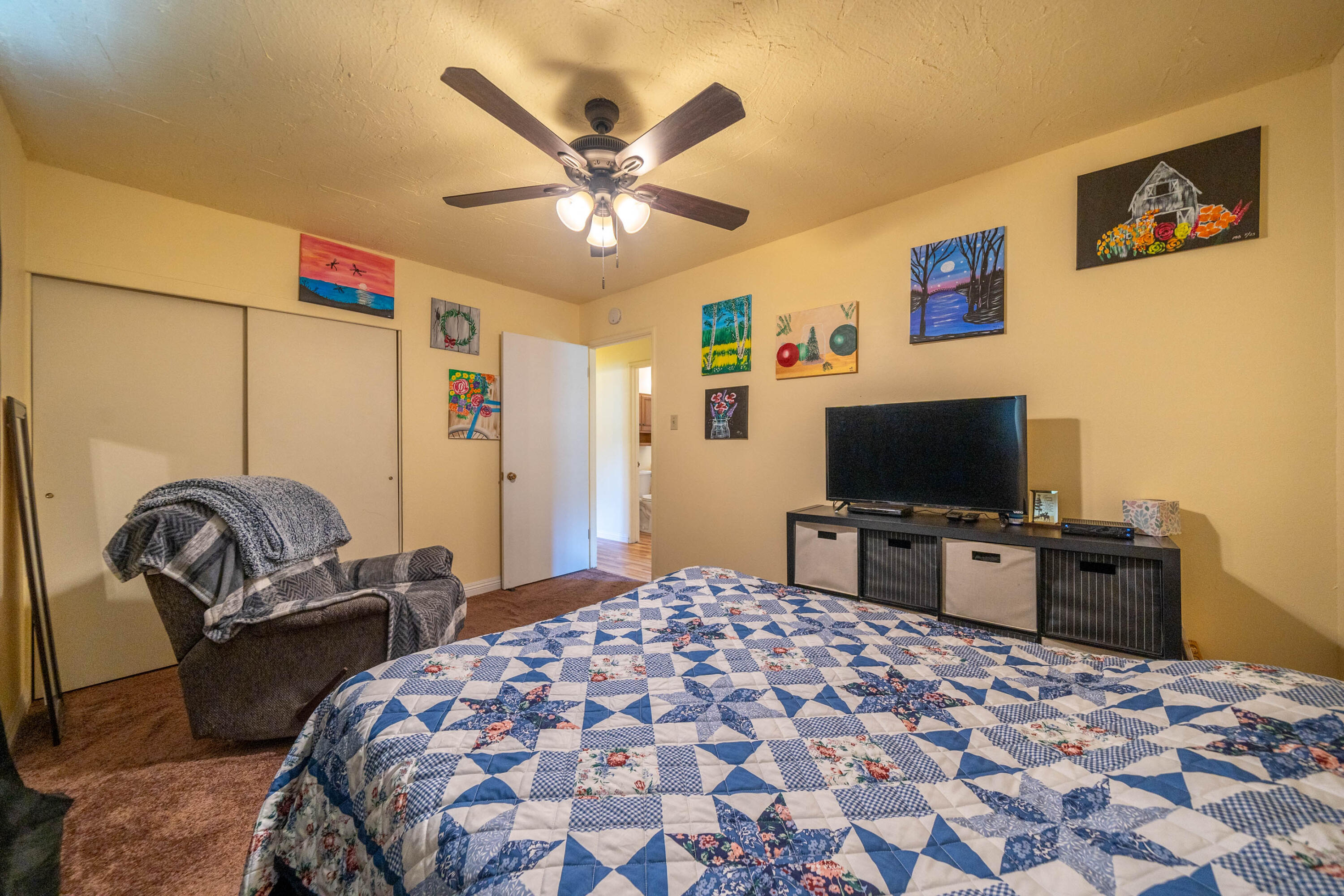 3055 Sharon Avenue Anderson, CA 96007 - Photo 19 of 52 a bedroom with a bed and a flat screen tv