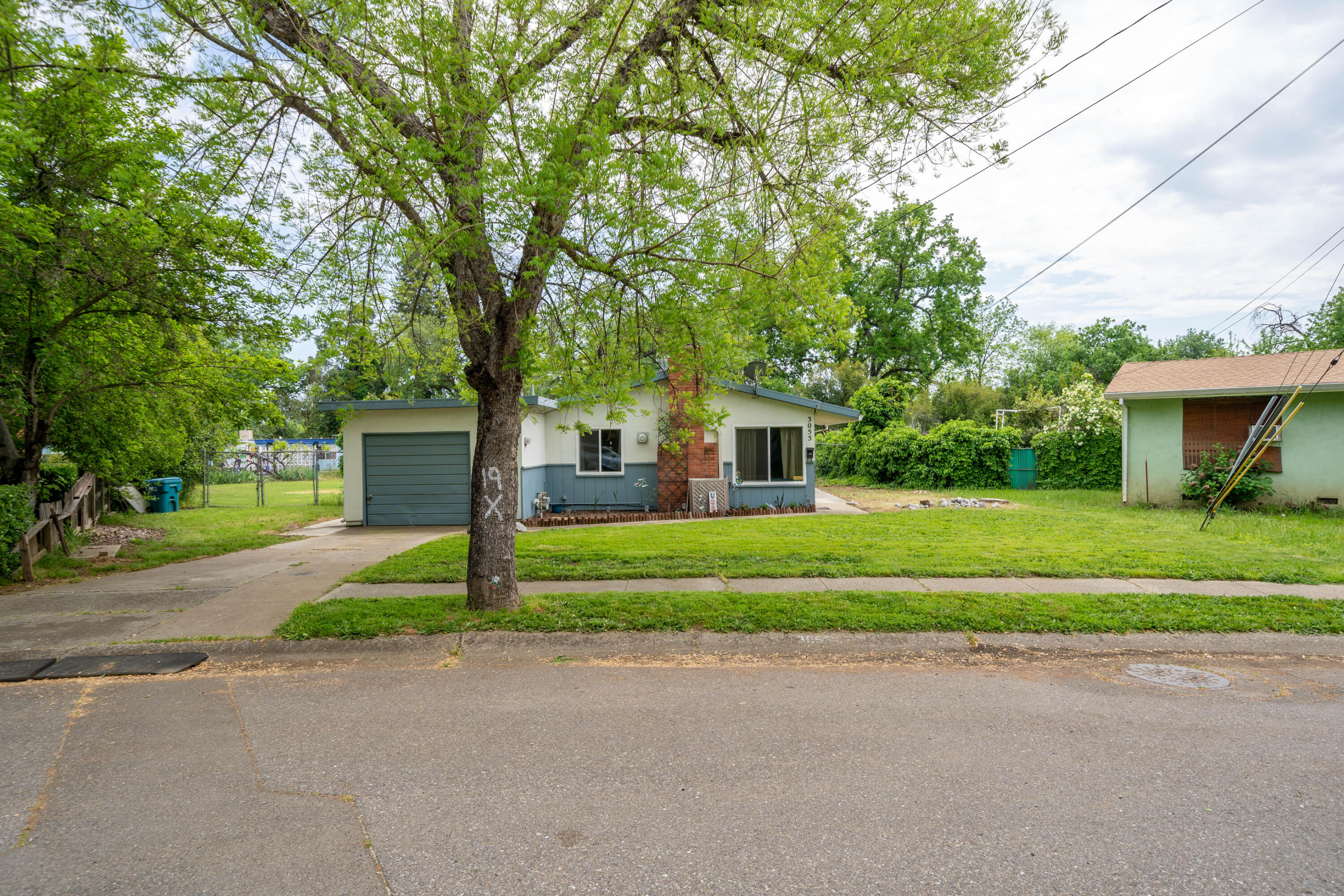 3055 Sharon Avenue Anderson, CA 96007 - Photo 2 of 52 a front view of a house with a yard and trees