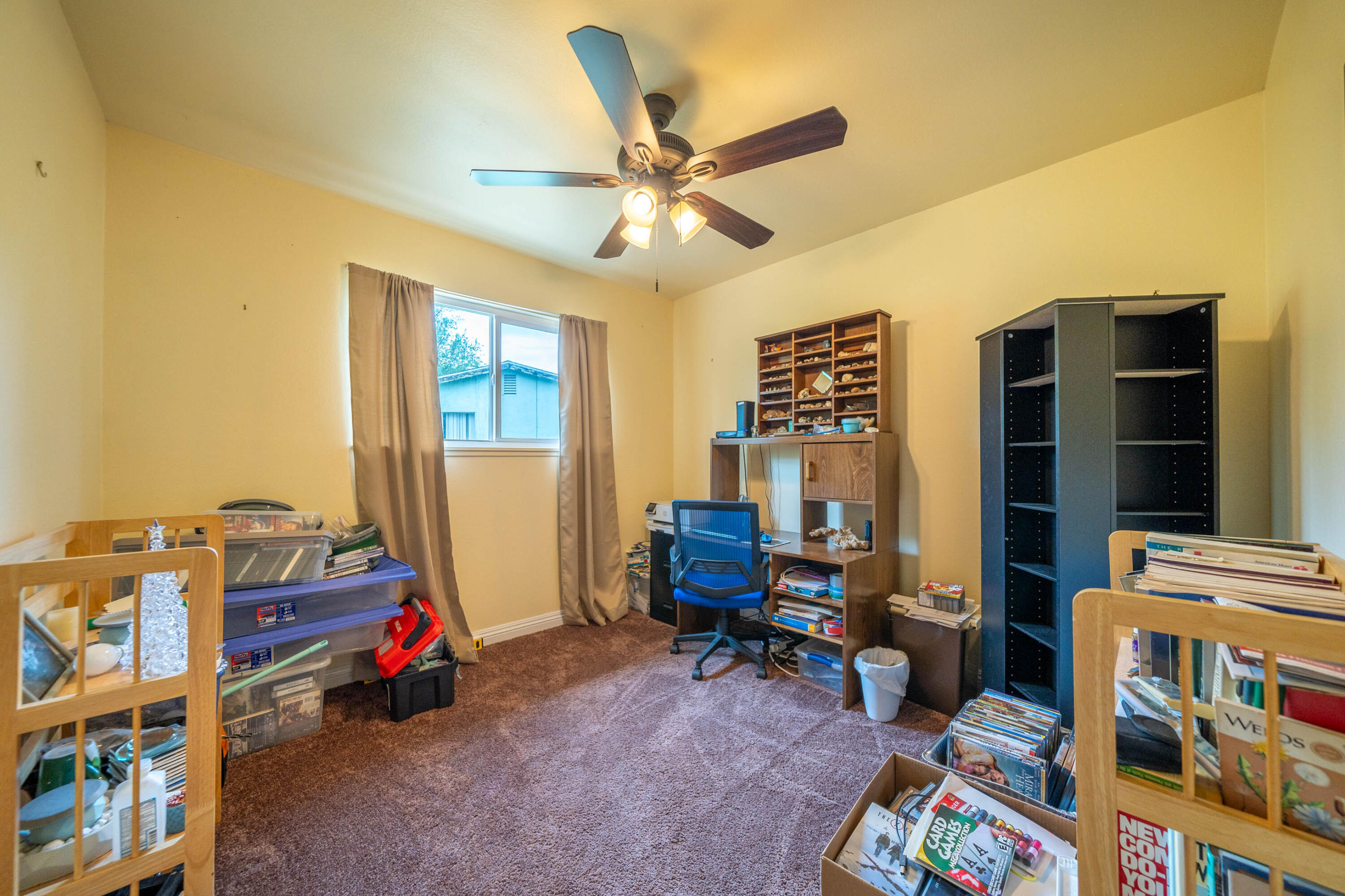 3055 Sharon Avenue Anderson, CA 96007 - Photo 23 of 52 a living room with furniture and a baby crib