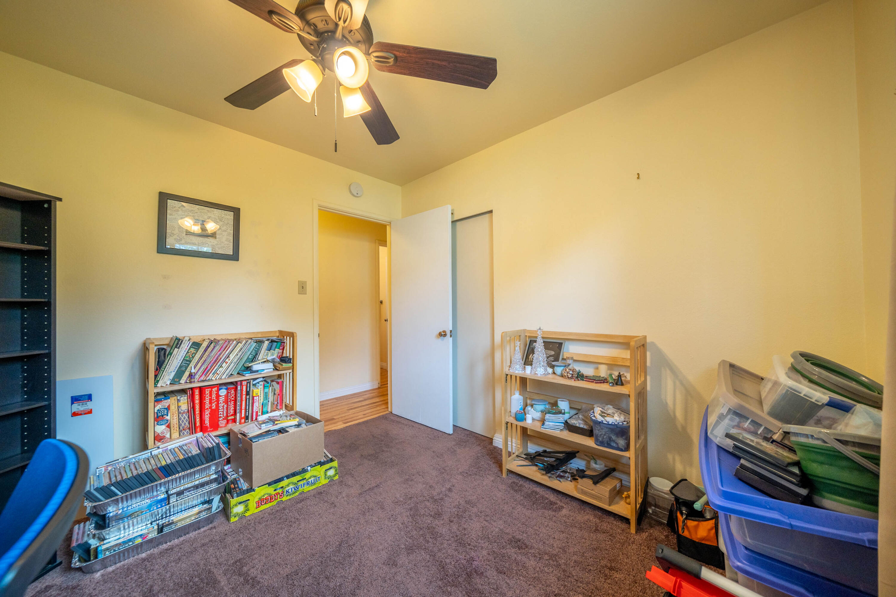 3055 Sharon Avenue Anderson, CA 96007 - Photo 24 of 52 a bedroom with furniture and a book shelf
