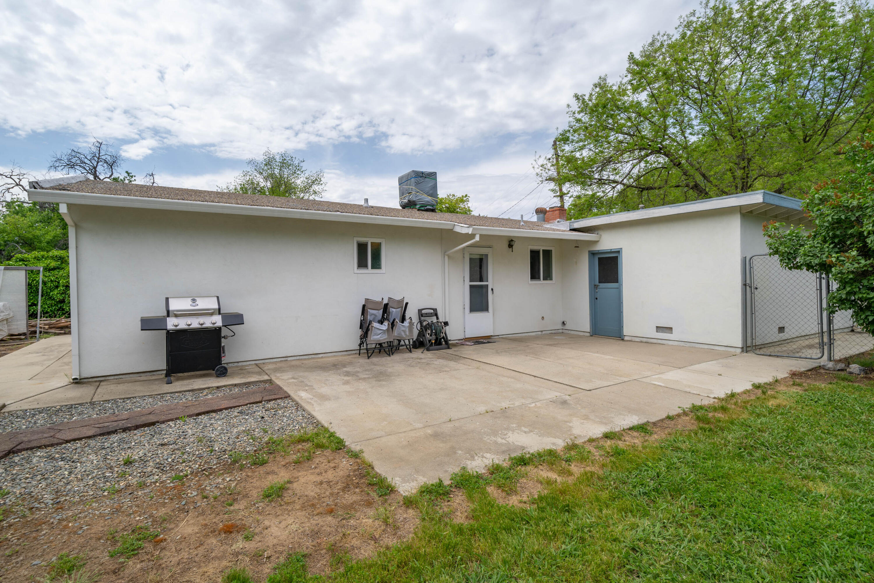 3055 Sharon Avenue Anderson, CA 96007 - Photo 27 of 52 a view of a backyard with plants and a patio