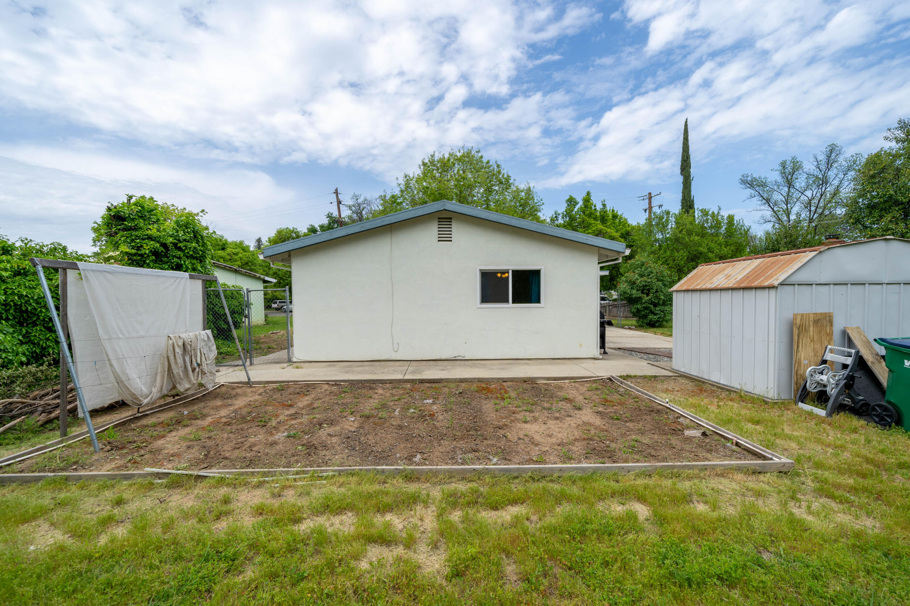 3055 Sharon Avenue Anderson, CA 96007 - Photo 32 of 52 a backyard of a house with table and chairs