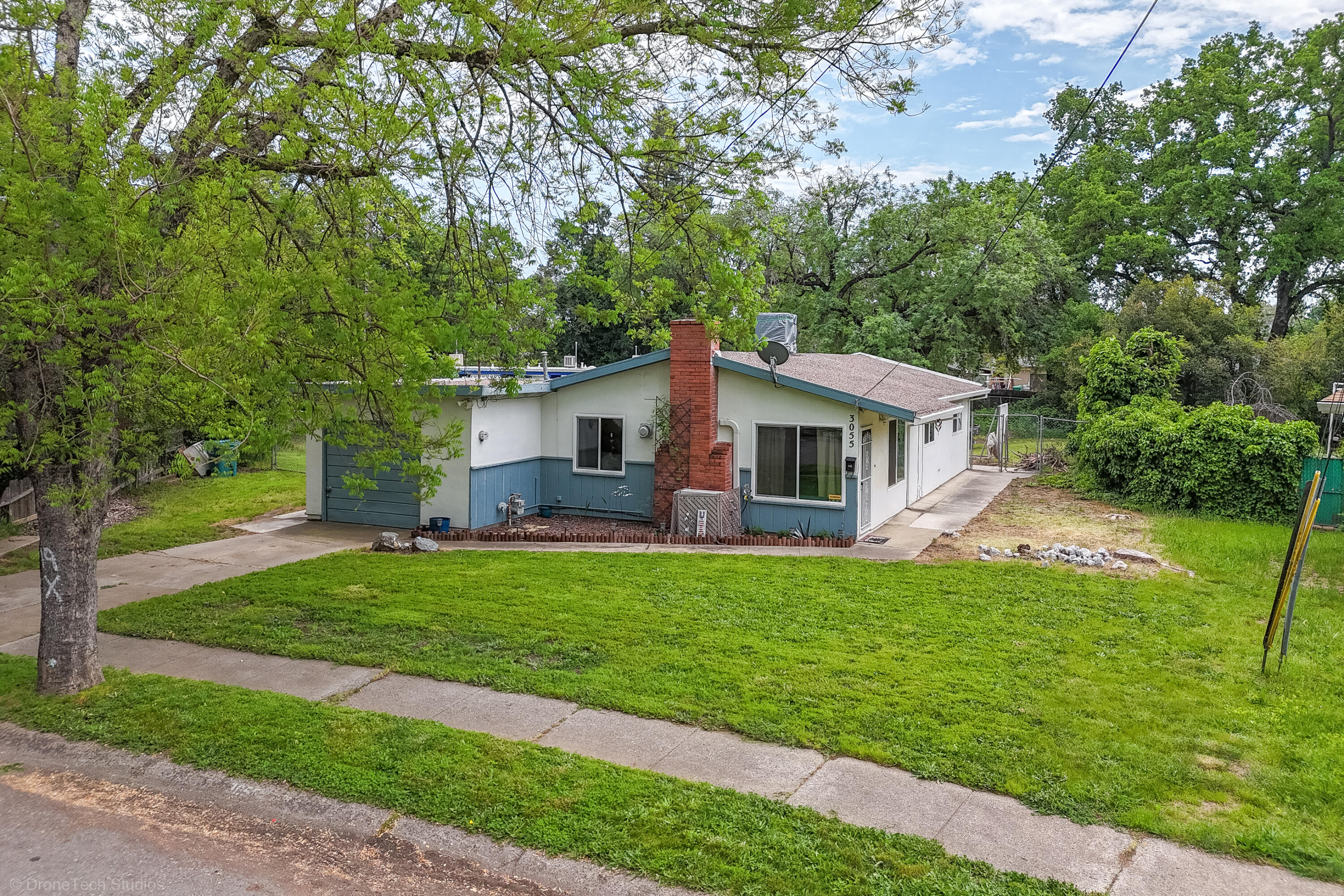 3055 Sharon Avenue Anderson, CA 96007 - Photo 39 of 52 a front view of a house with a garden